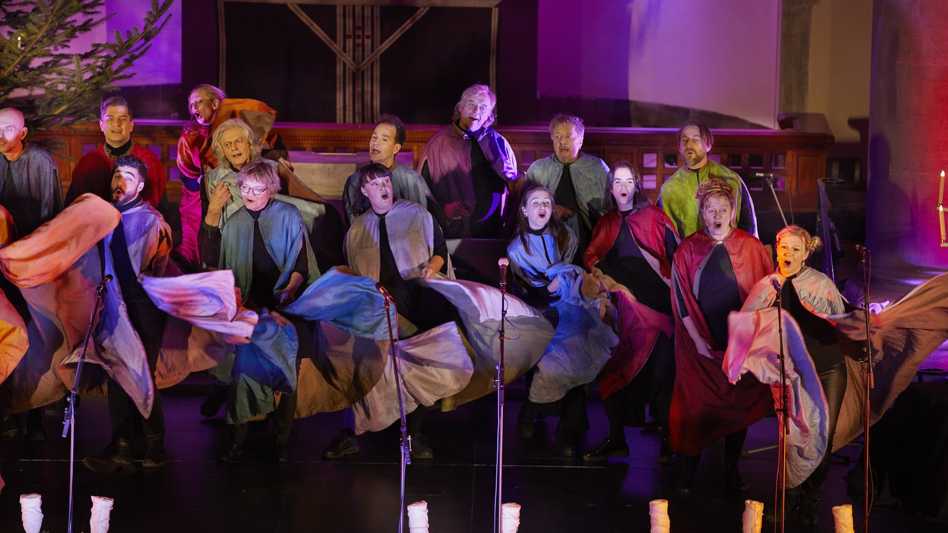 A choir in motion with coats of different colors