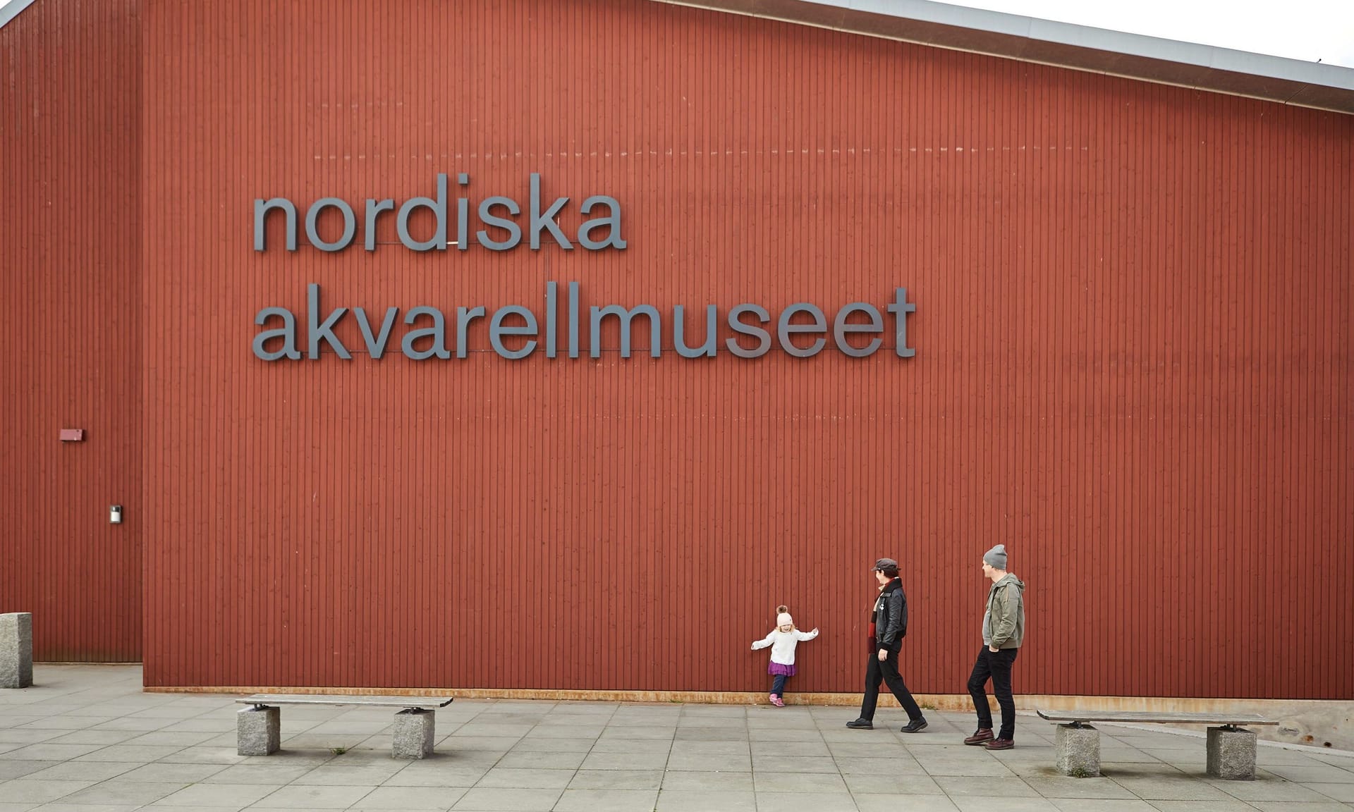 Family in front of museum facade