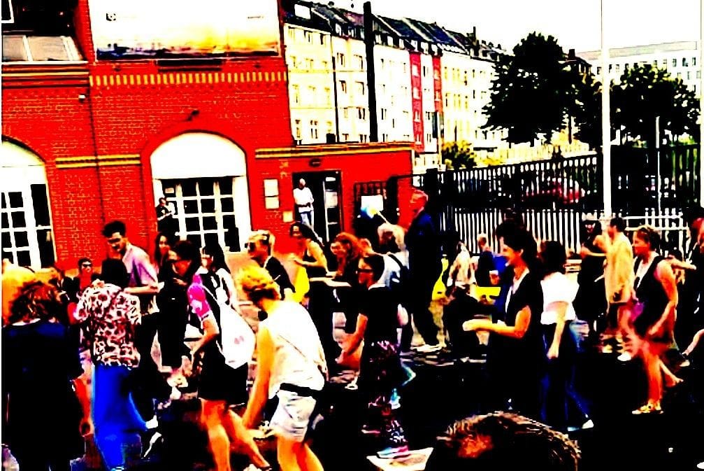 People dancing in a blurred photo