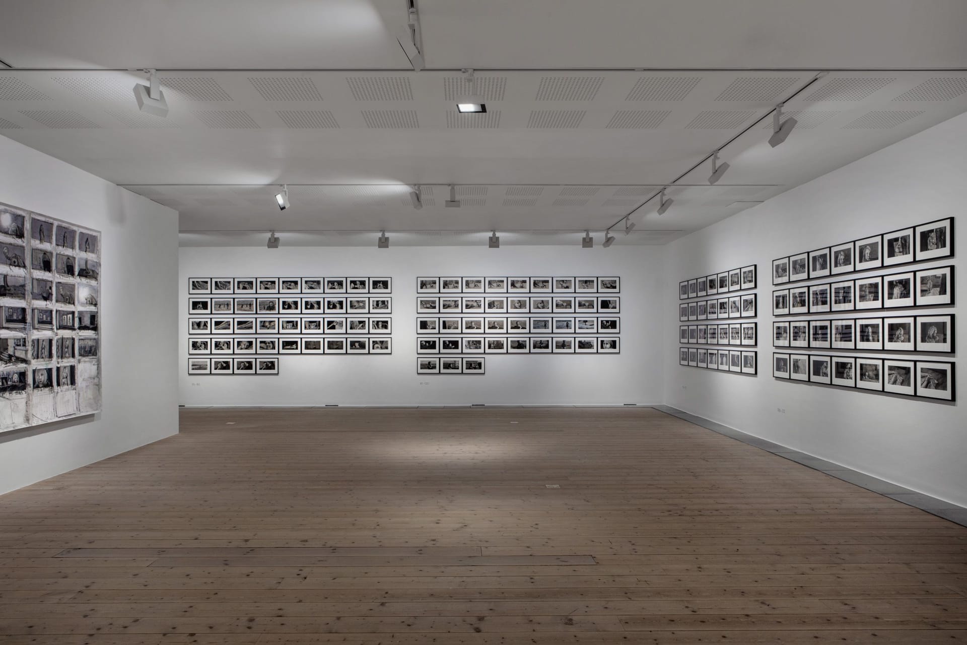 White walls covered with paintings in black and white