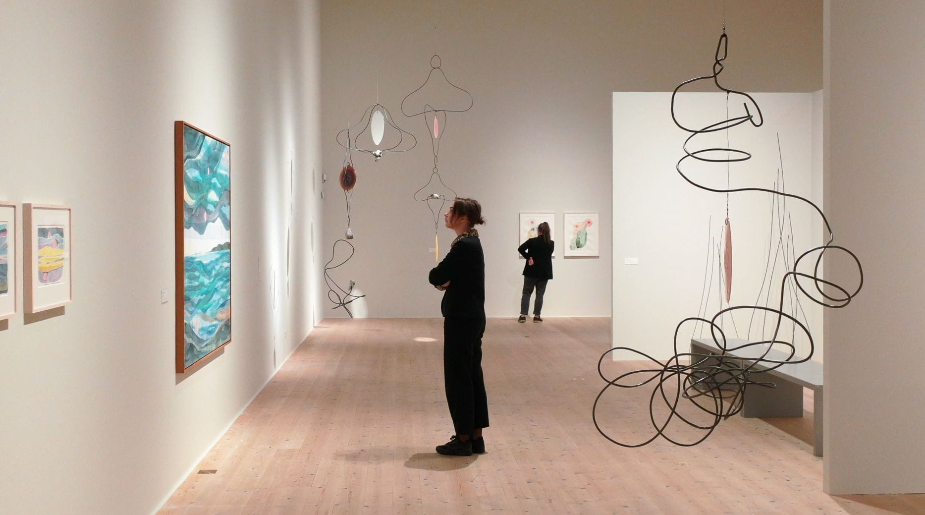 Visitors in a bright exhibition hall