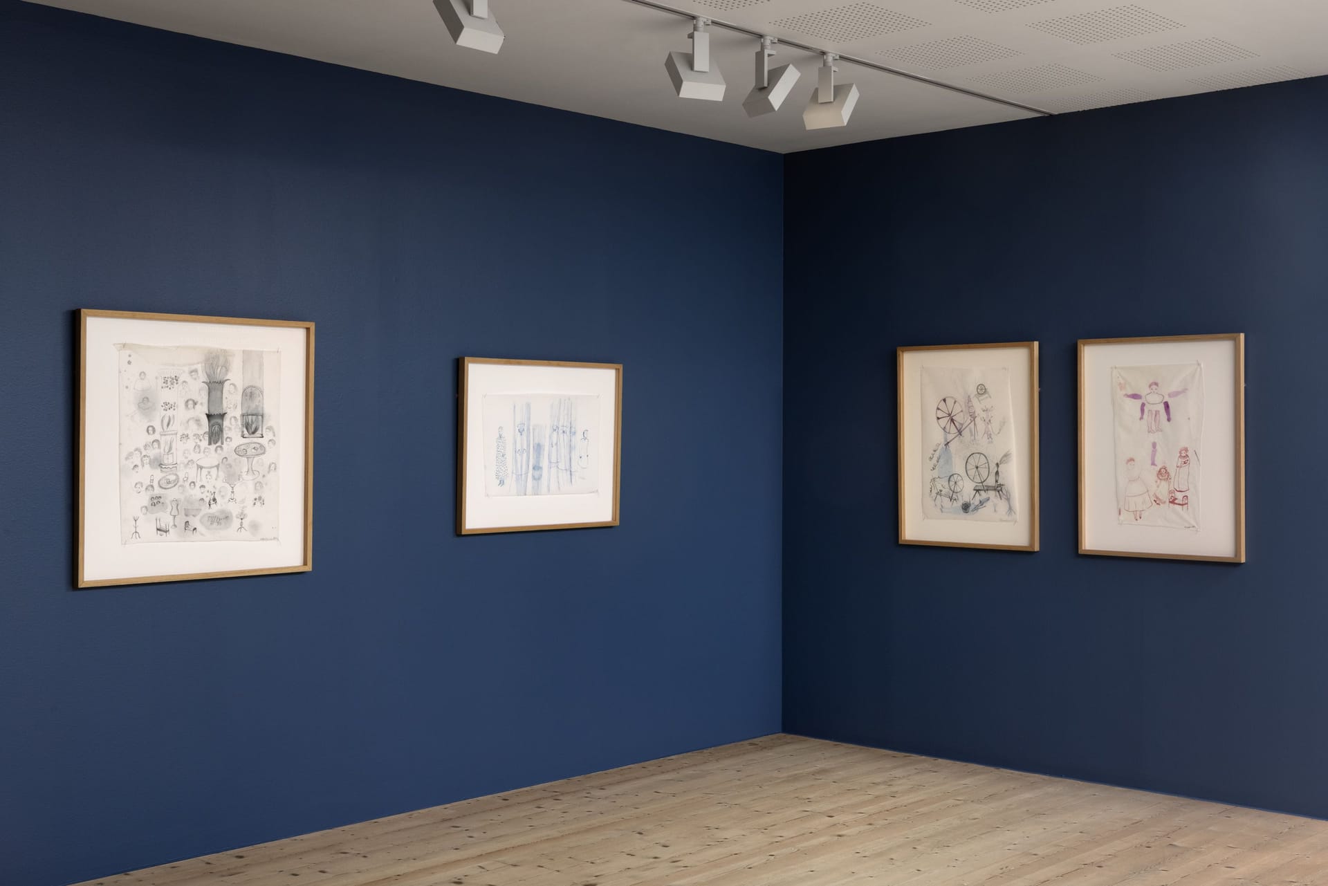 Works by Astrid Svangren on blue wall