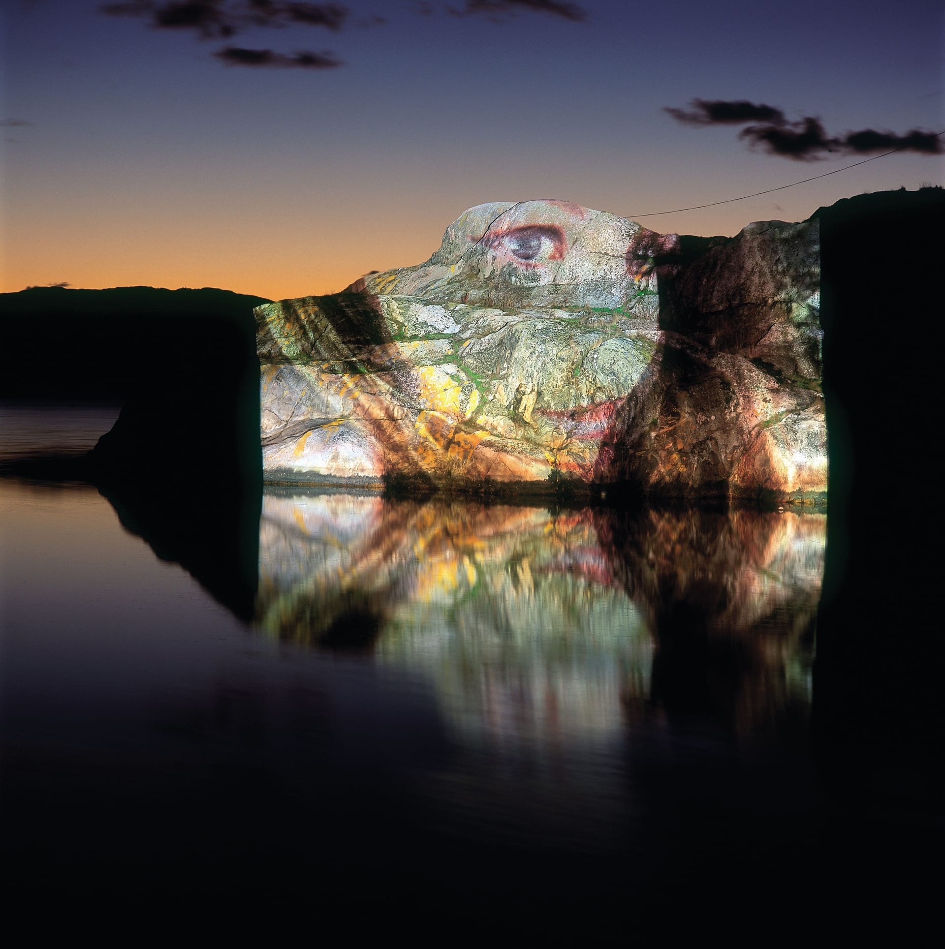 The video work "Study In Scarlet 1-3" by Lena Mattsson is projected on cliffs 2004