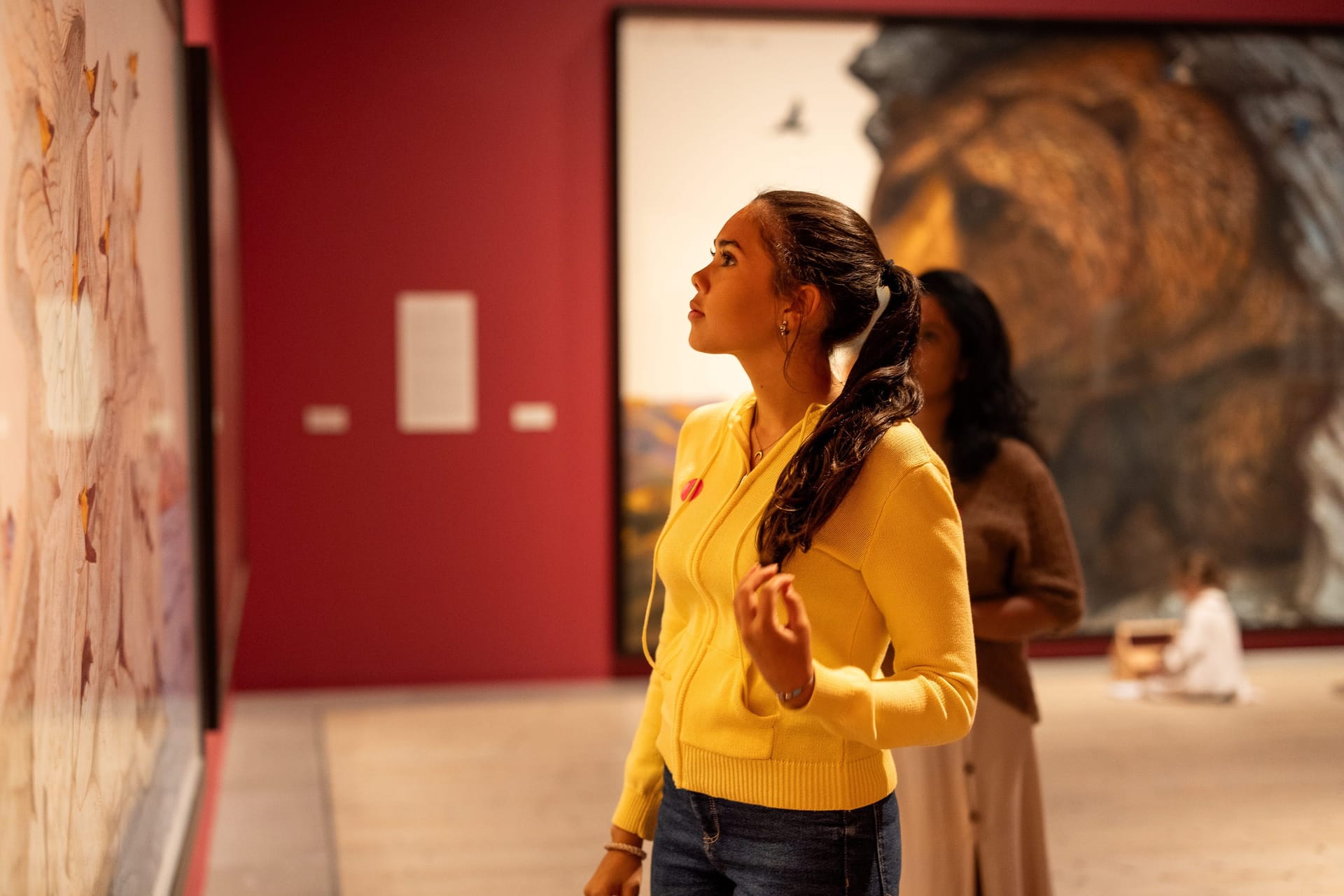 Visitors in front of painting