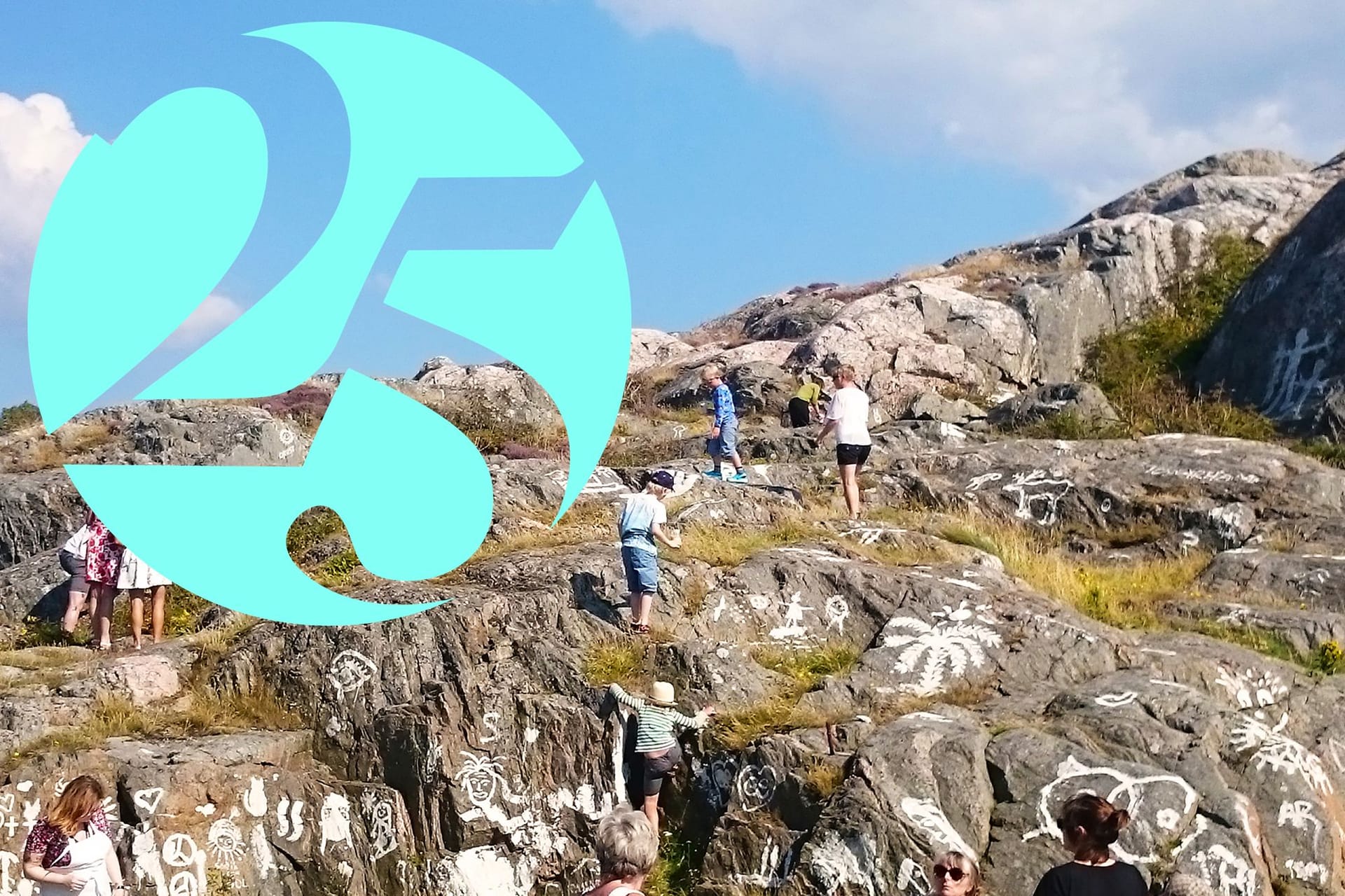 People painting on cliffs with white paint