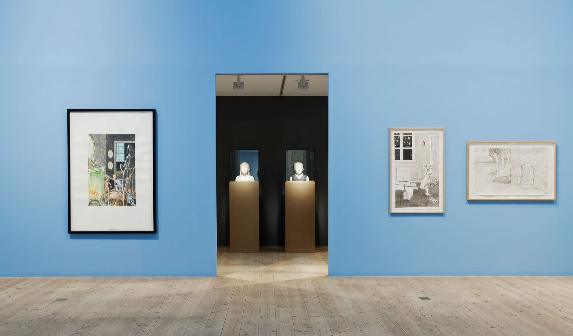 Light blue exhibition room with paintings.