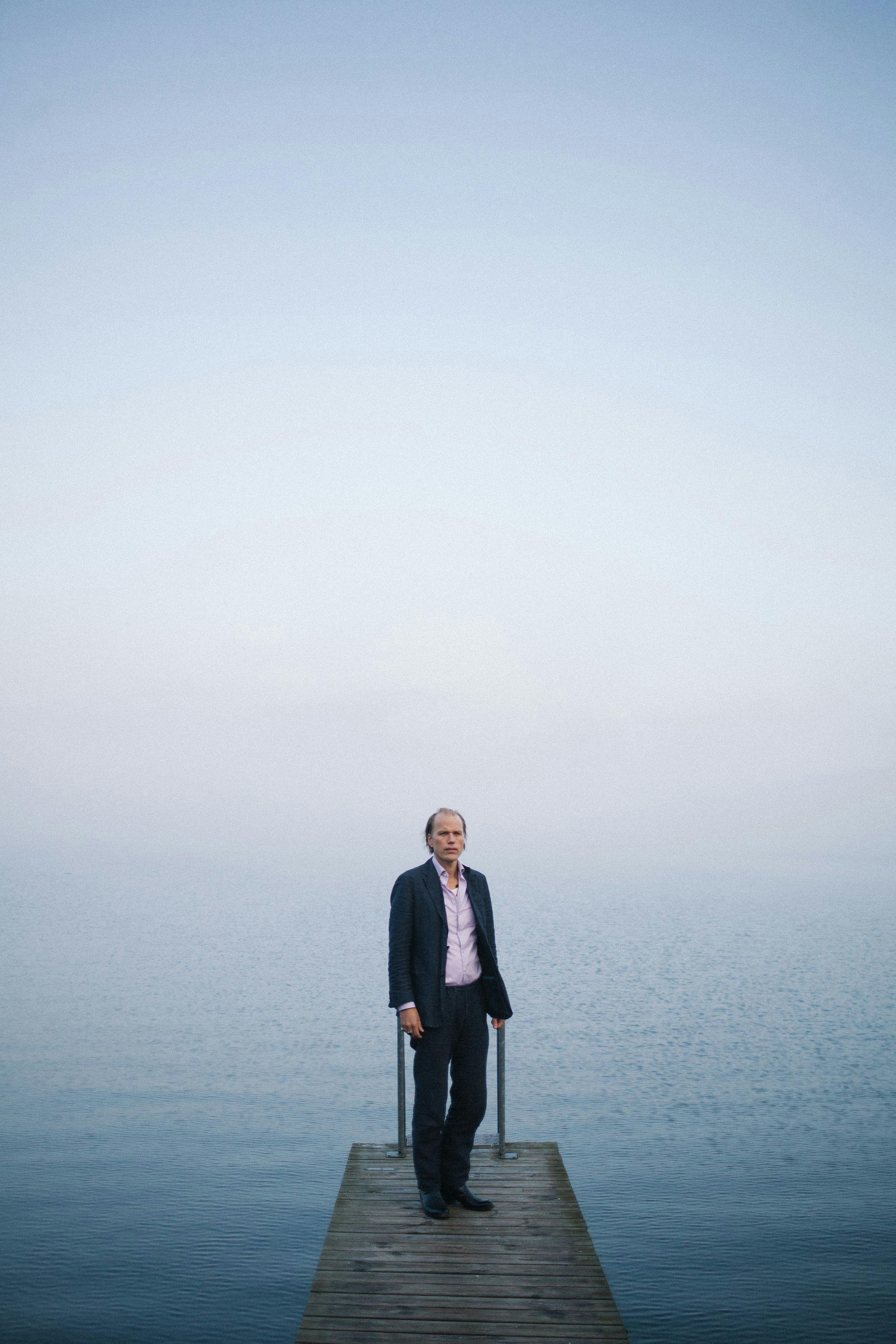 Photo of Christian Kjellvander in front of the ocean