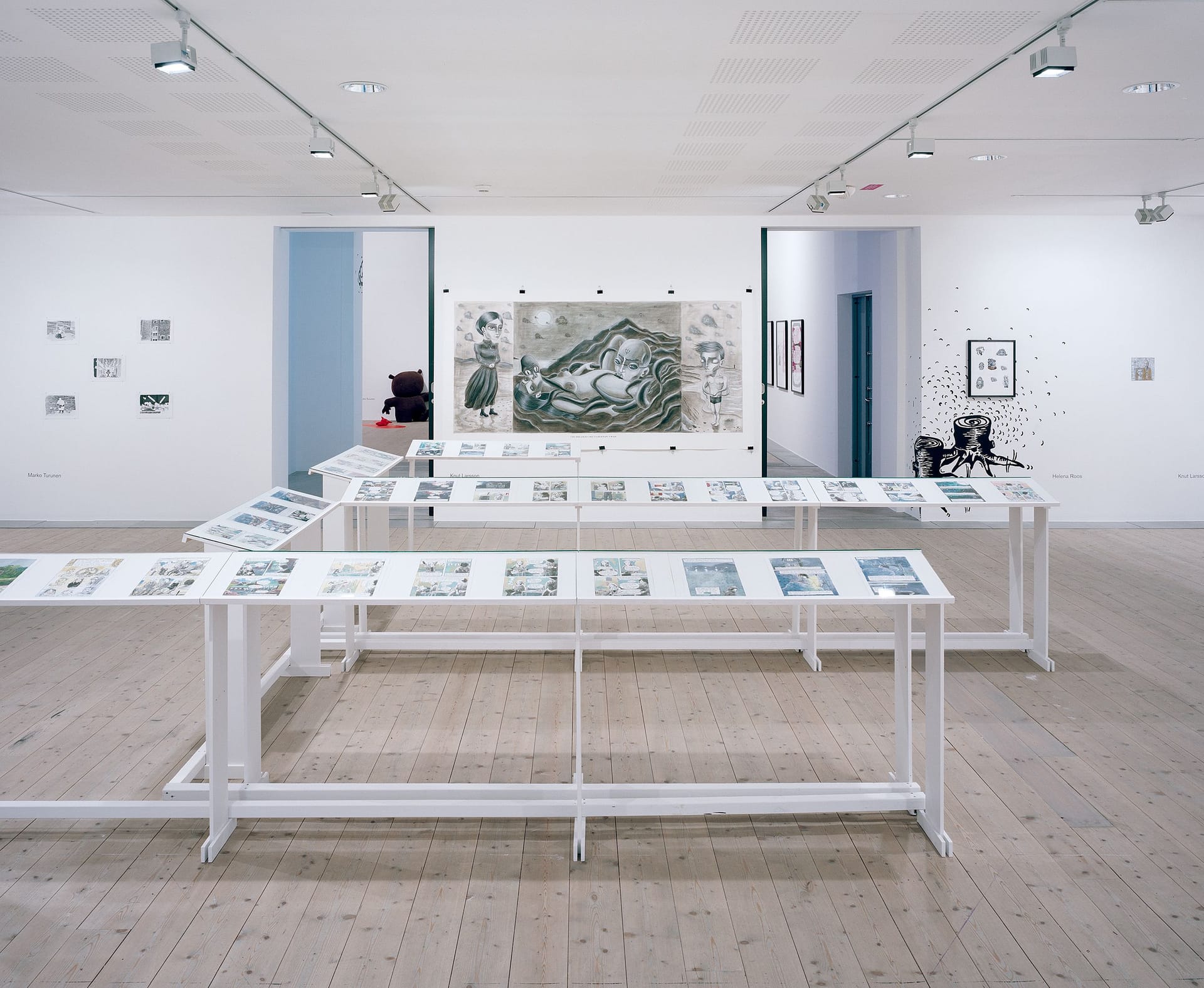 Exhibition room with tables and images