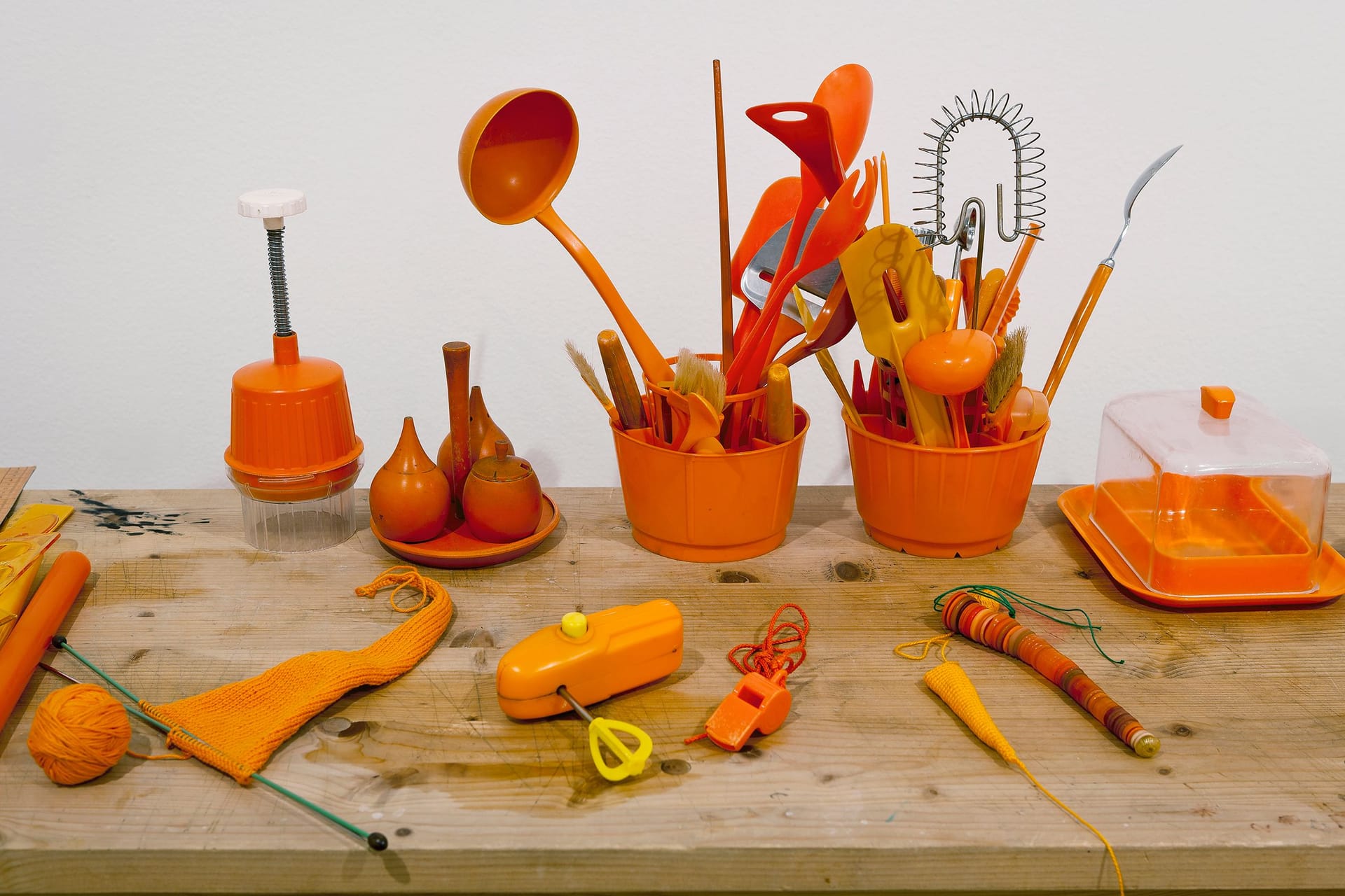 Detail from a work by Anu Tuominen, featuring objects in orange.