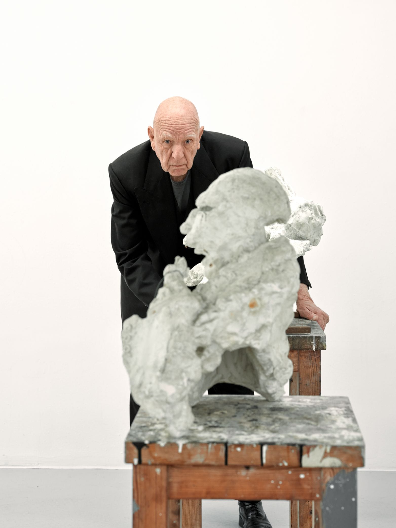 Portrait of Claes Hake behind sculpture
