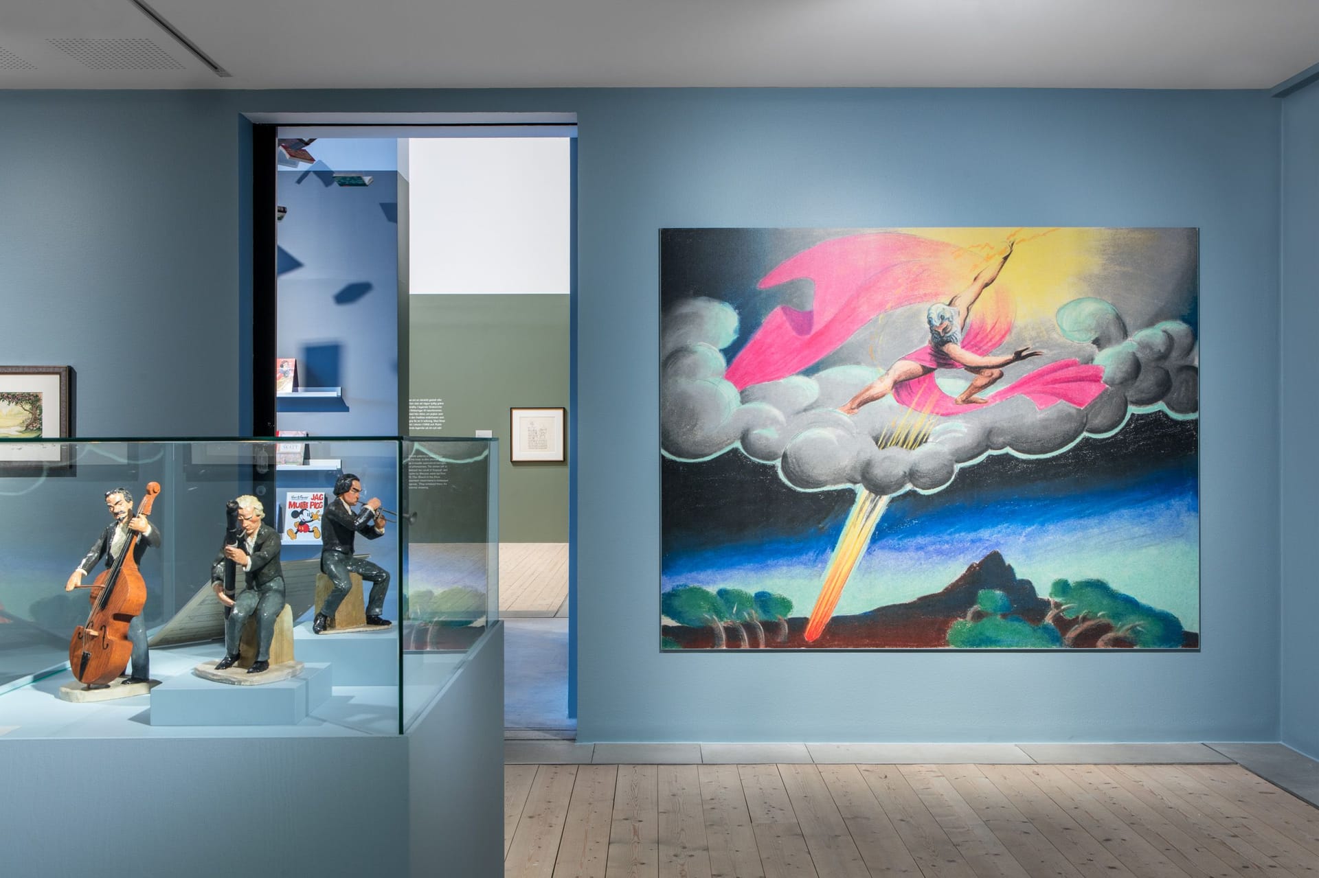 Displays with inspirational sculptures for the movie Fantastia, in the background a large reproduction from the same film