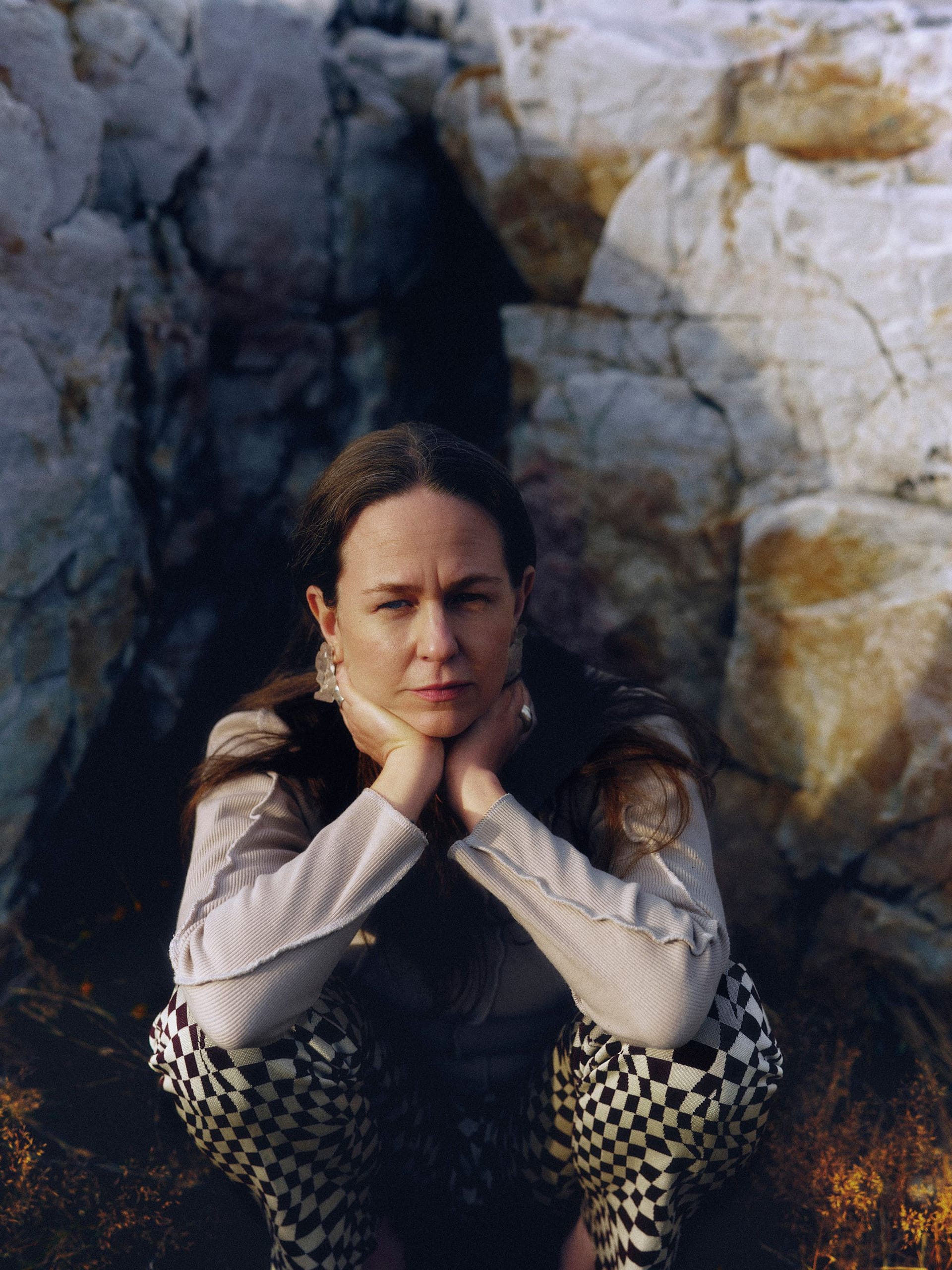 Artist Alice Boman sitting outdoors