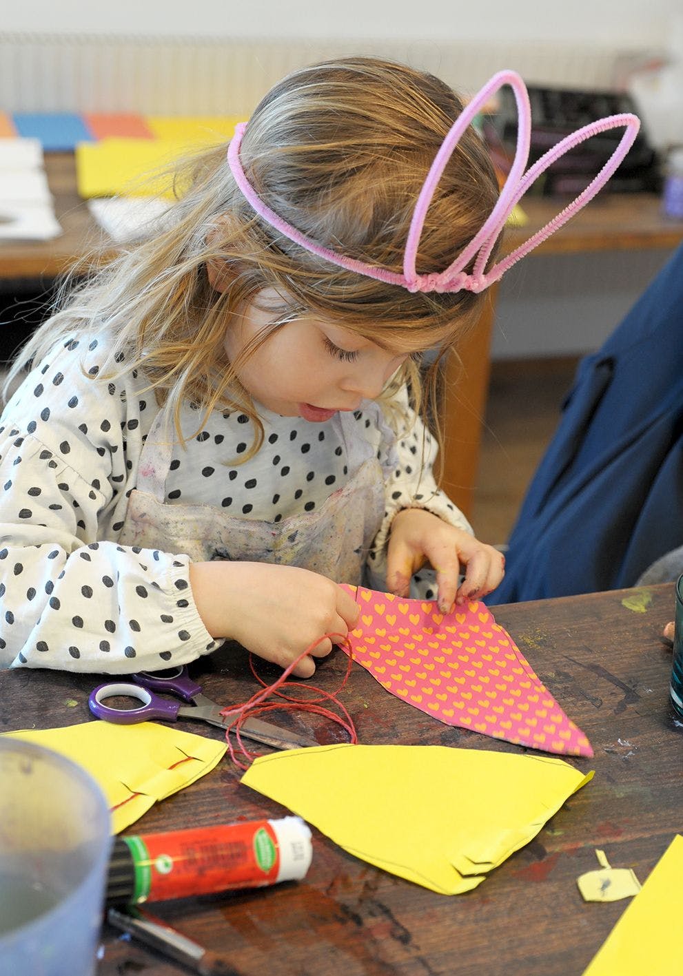 Kid crafting in paper