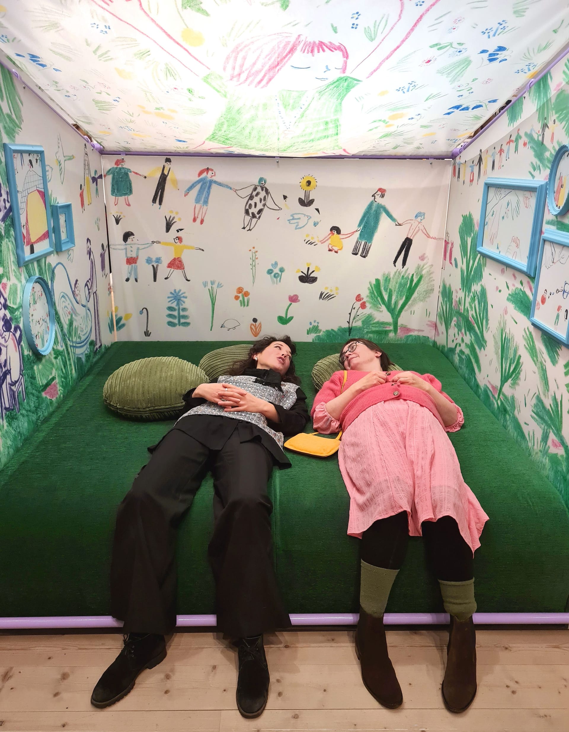 Two persons laying in a tent of images